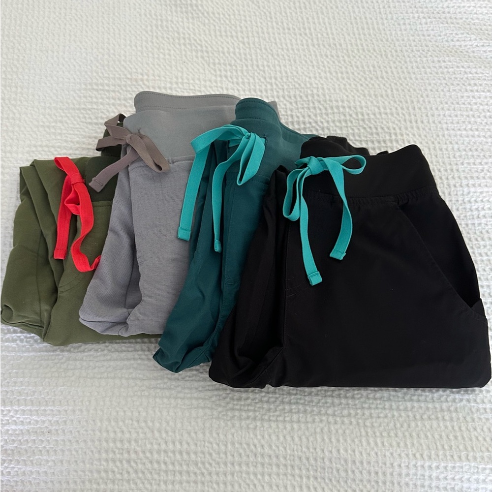4 pairs Figs scrubs jogger Zamora pants. Black, teal, gray, olive.